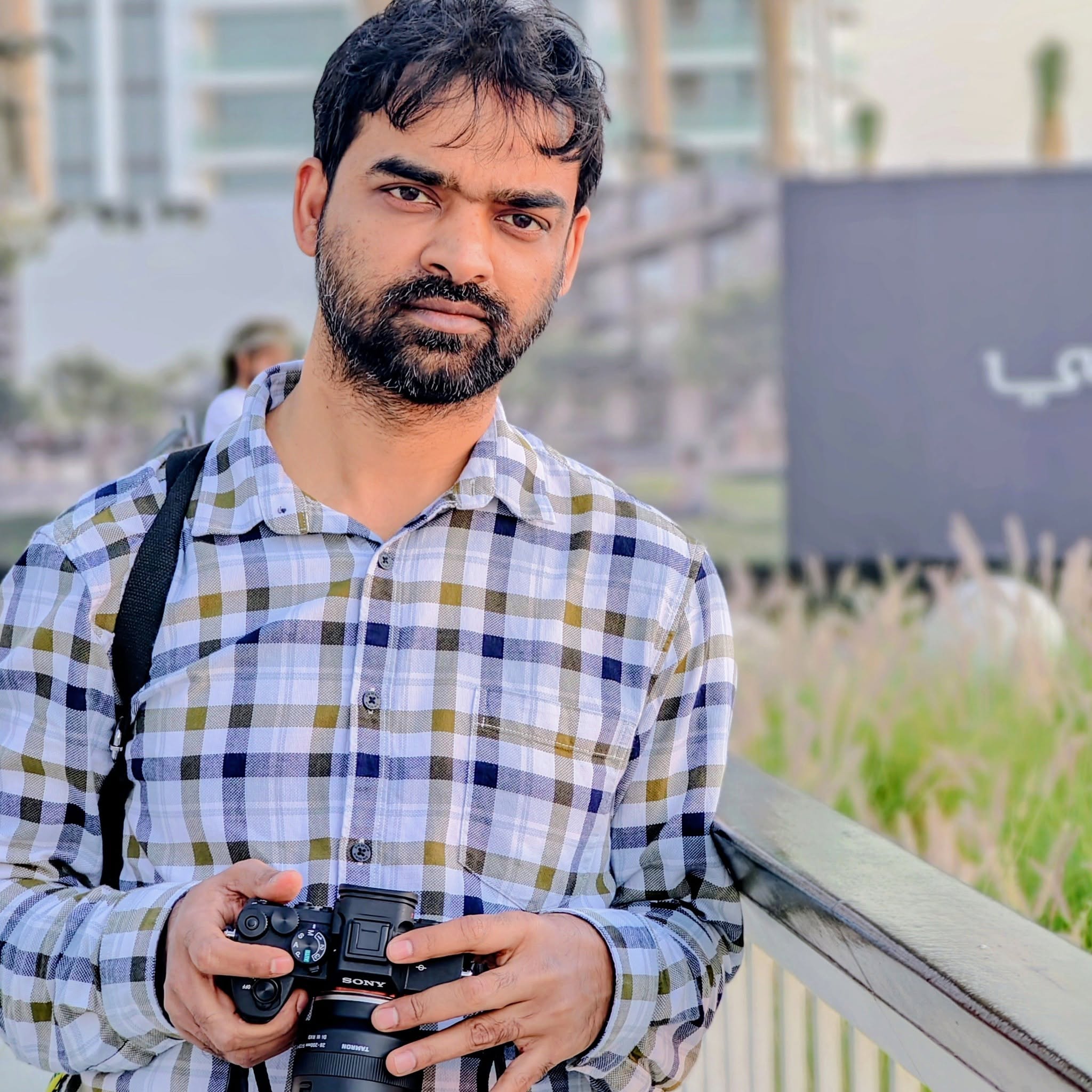 Zoheb holding a camera